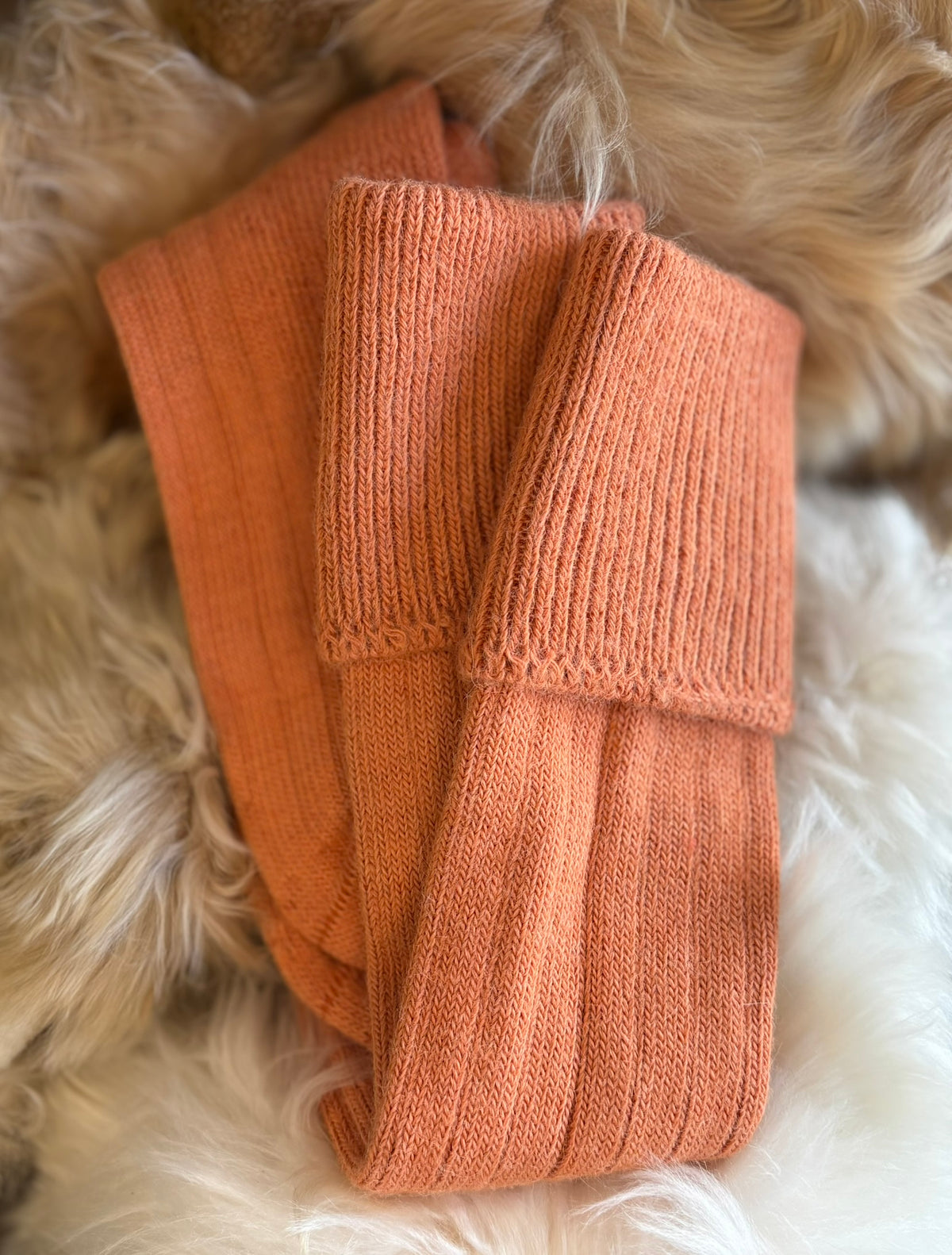 apricot alpaca country socks fluffy background
