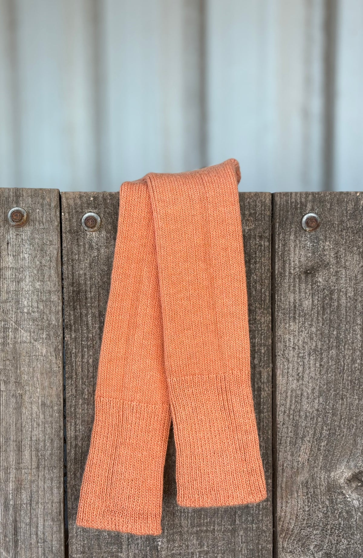 apricot three quarter alpaca socks on wooden gate
