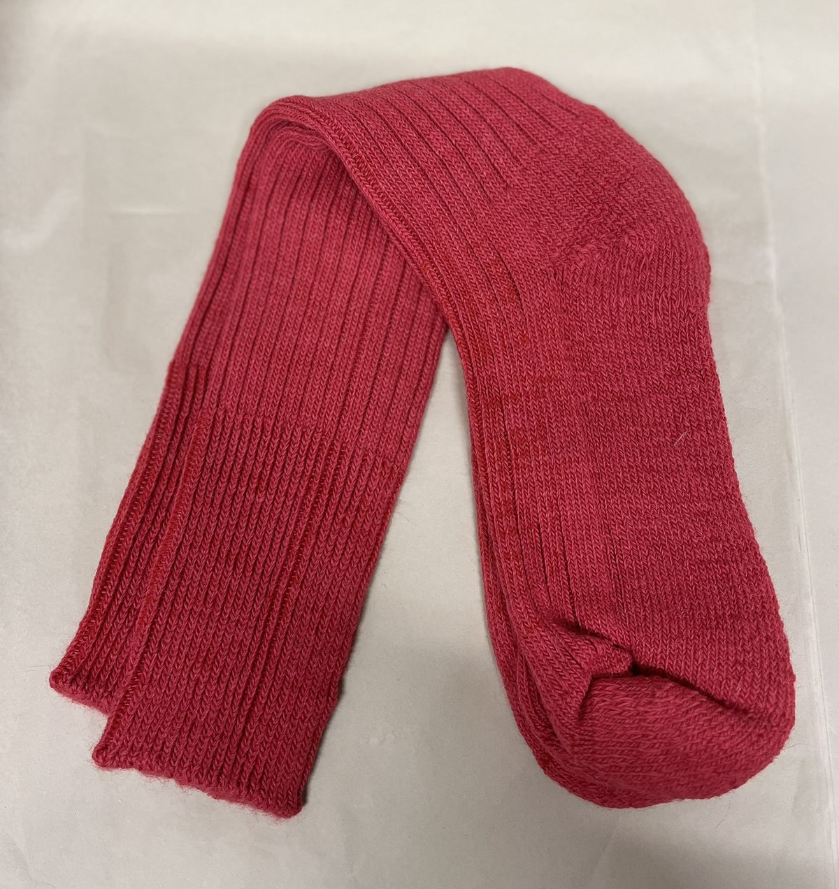 Burnt Orange three quarter alpaca socks on pale green background