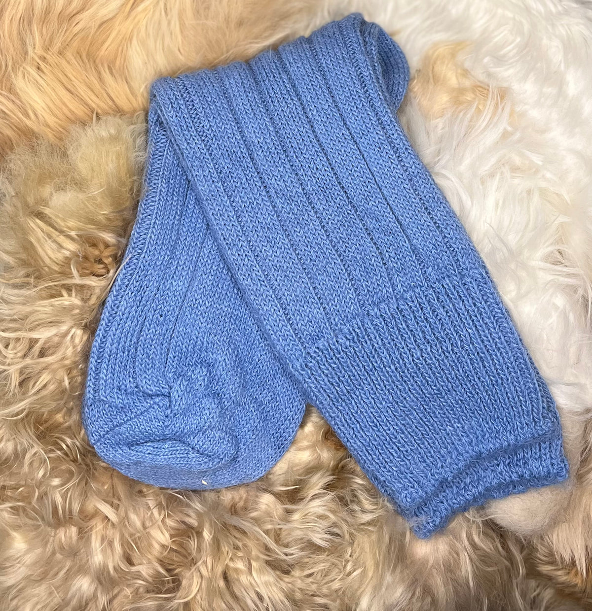 mid blue bed alpaca sock fluffy backgroung