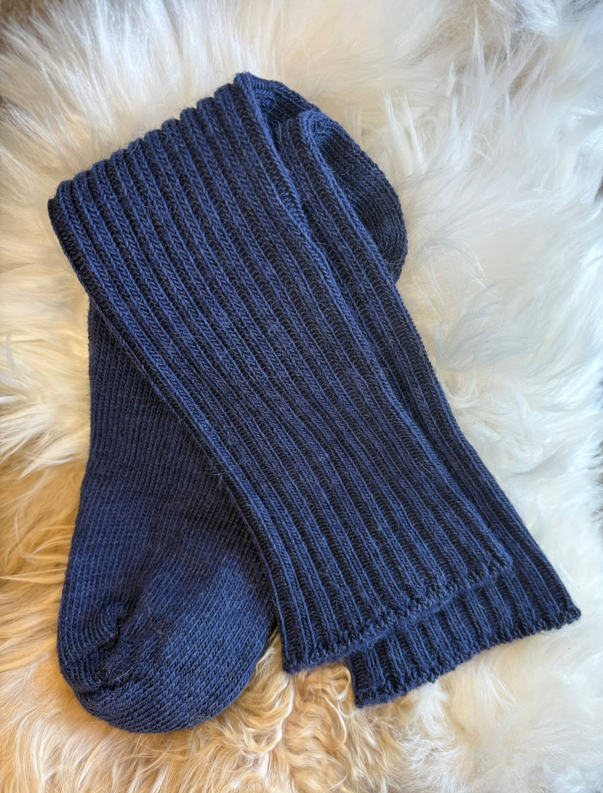 navy soft topped everyday alpaca sock on fluffy background