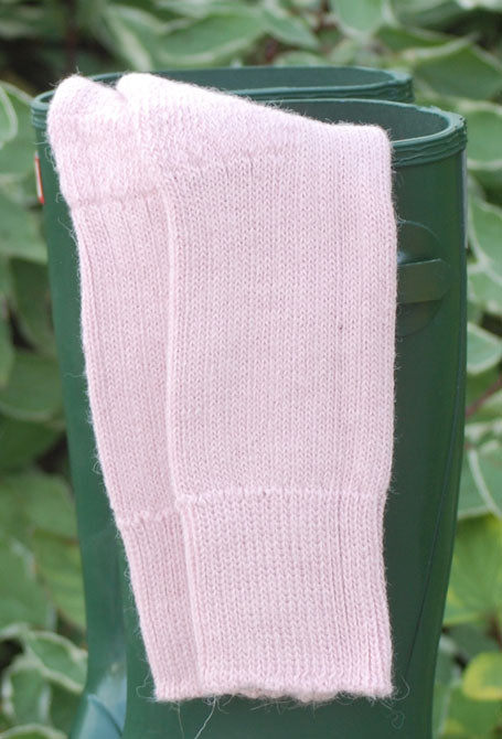Pale Pink Short Ribbed alpaca socks Child draped over Wellies