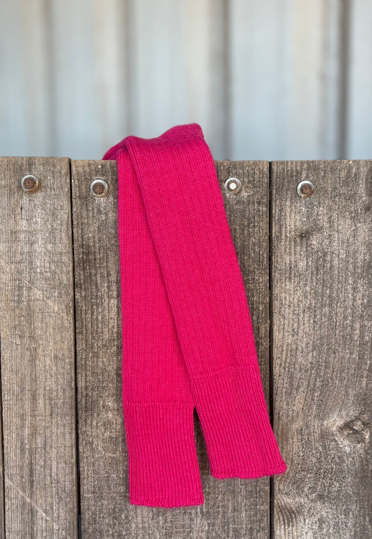 raspberry three quarter alpaca socks on wooden gate