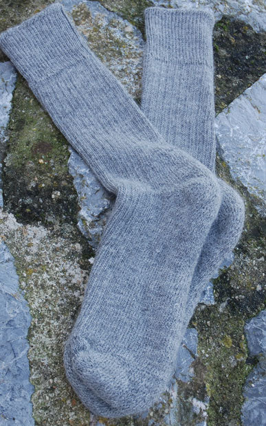 grey short ribbed alpaca socks rocky background