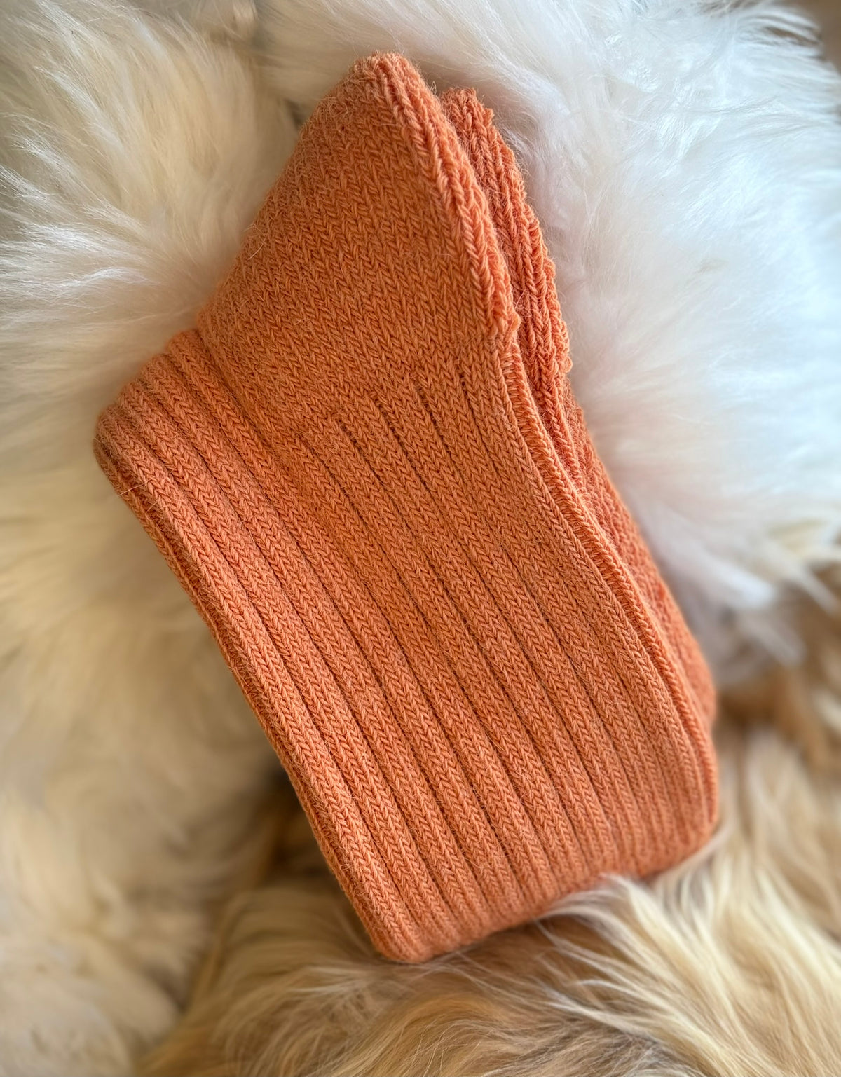 apricot short ribbed alpaca socks fluffy background