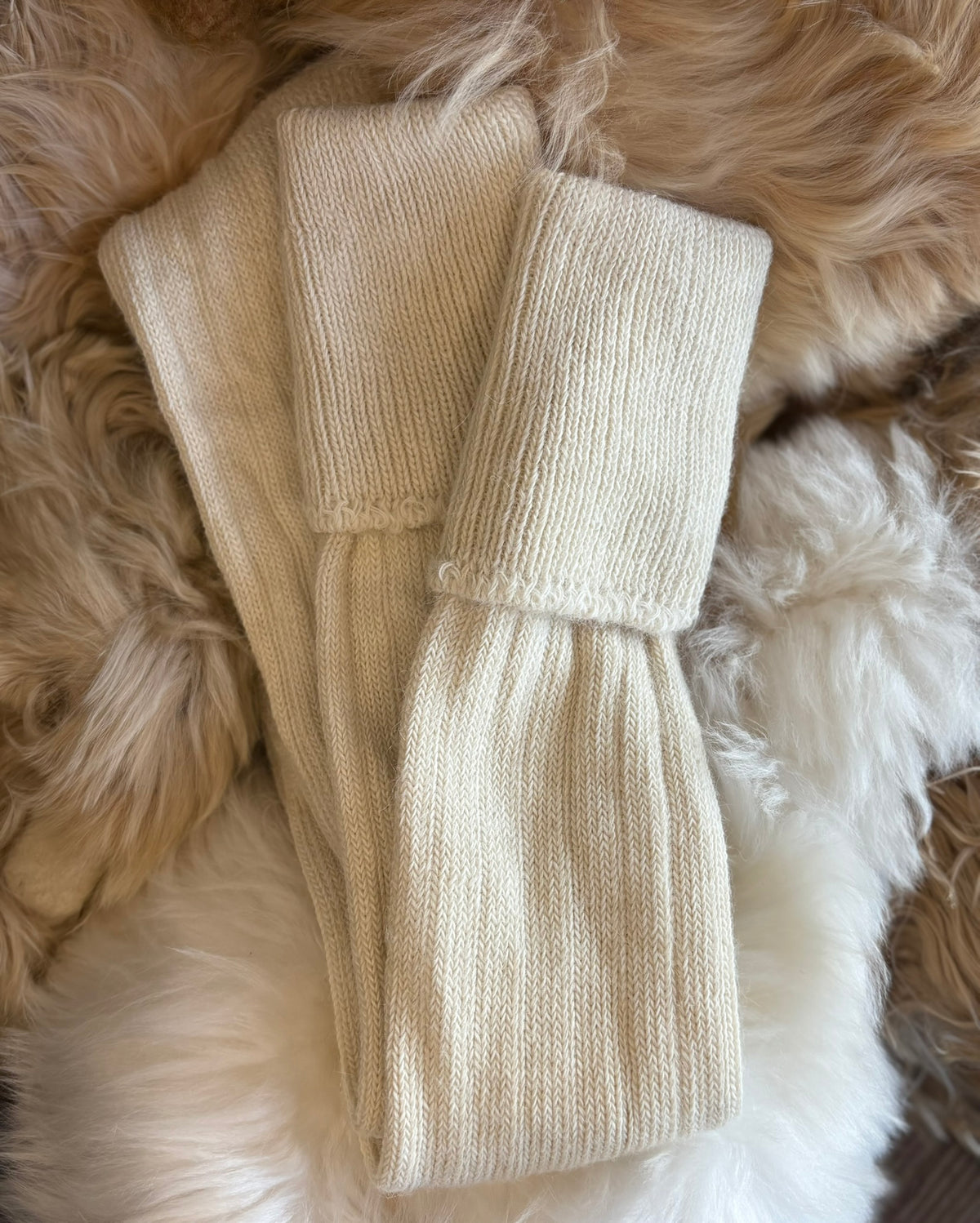 cream alpaca country socks fluffy background