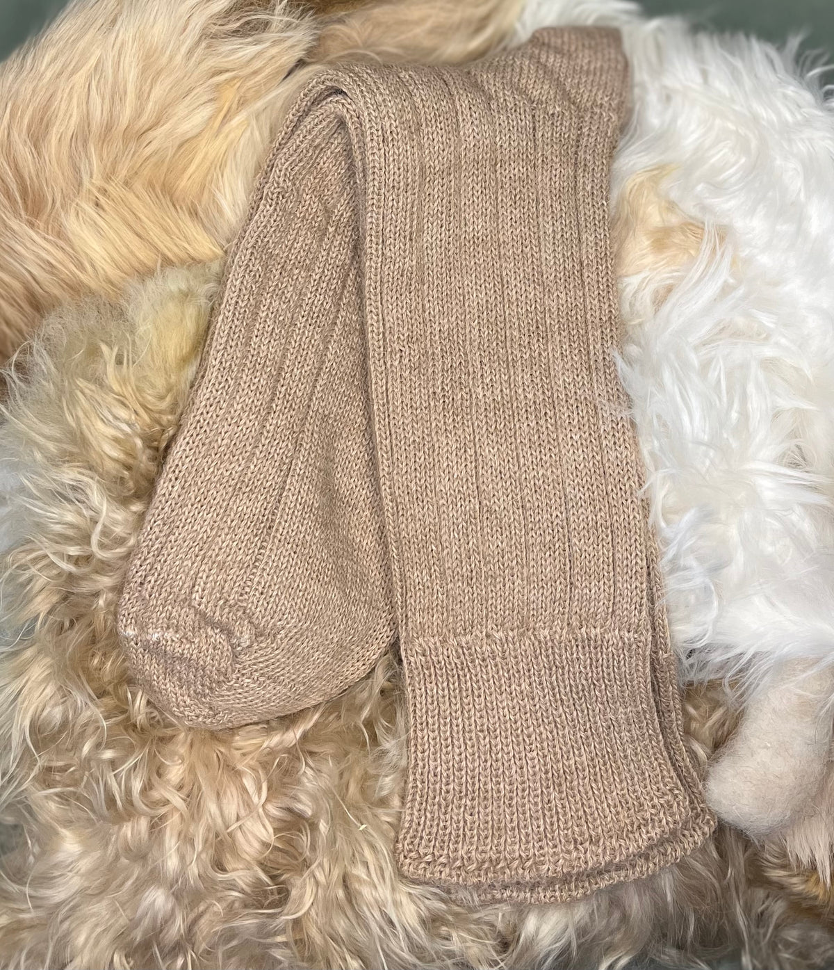 fawn bed alpaca socks fluffy background