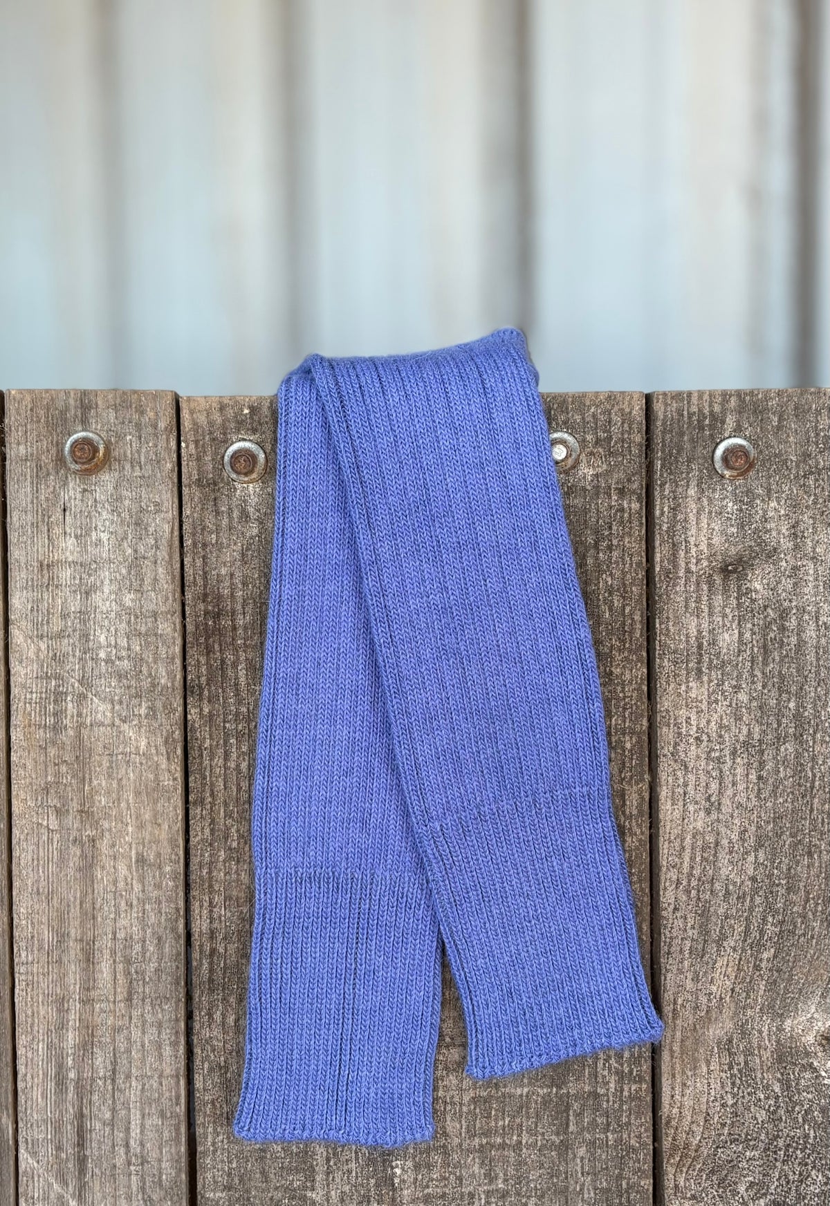 indigo three quarter alpaca socks on wooden gate 