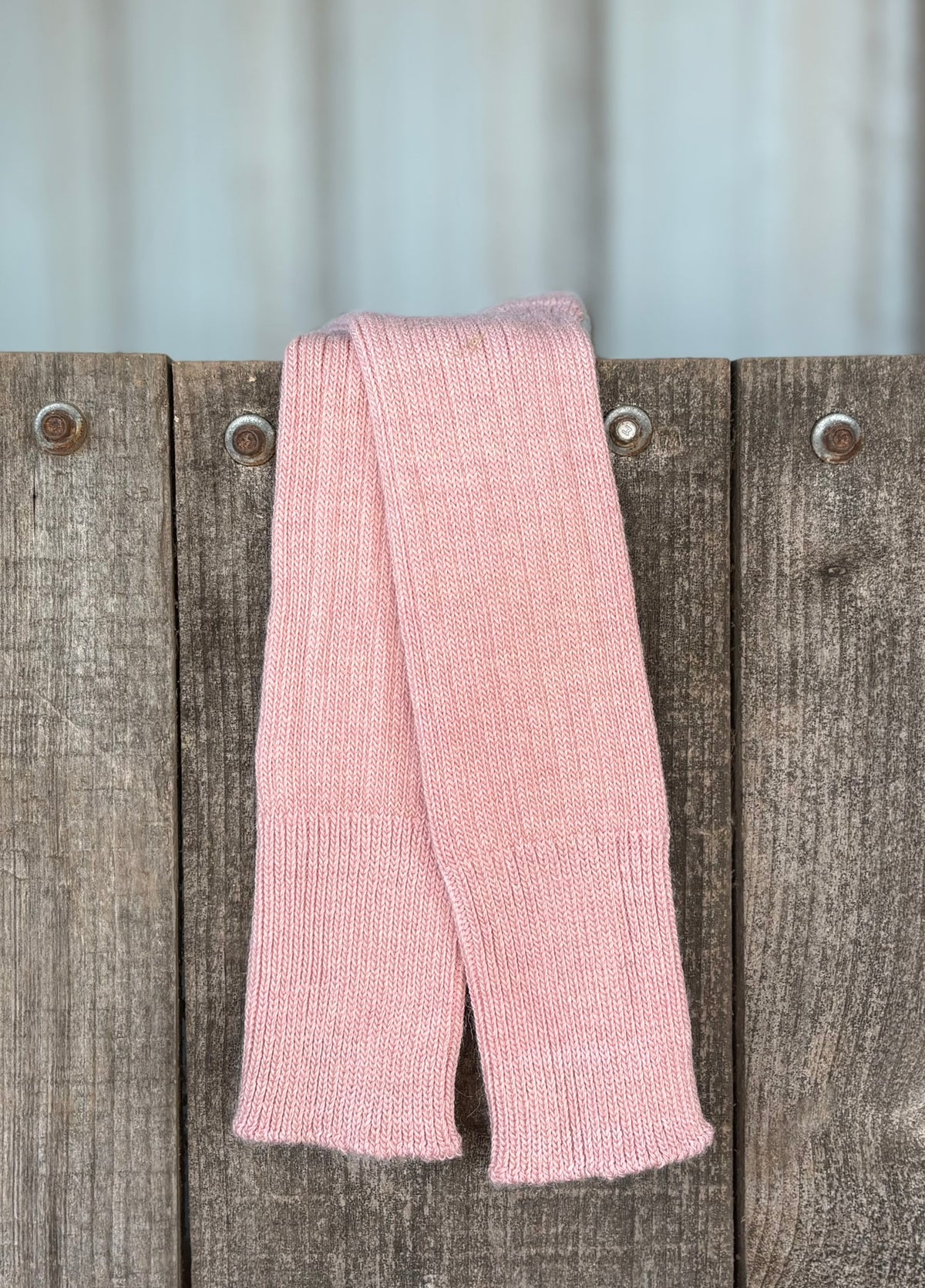 pale pink three quarter alpaca socks on wooden gate