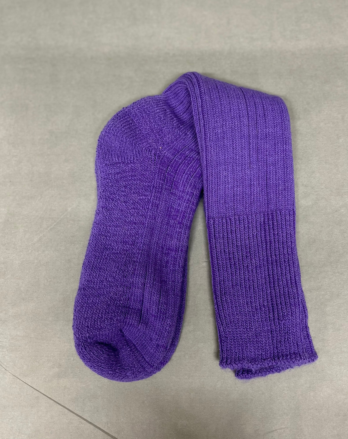 purple three quarter alpaca sock pale green background