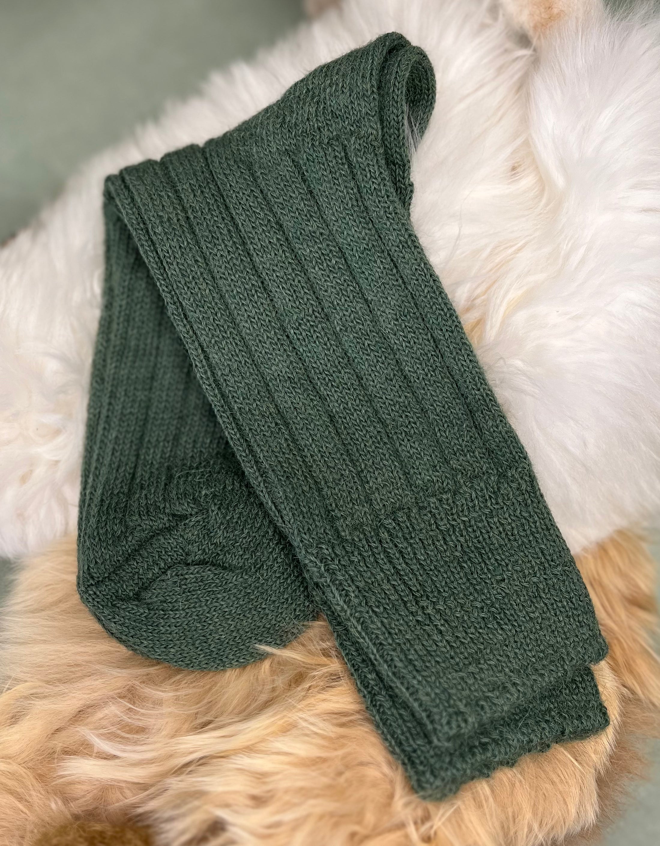 sedge green alpaca bed socks fluffy background