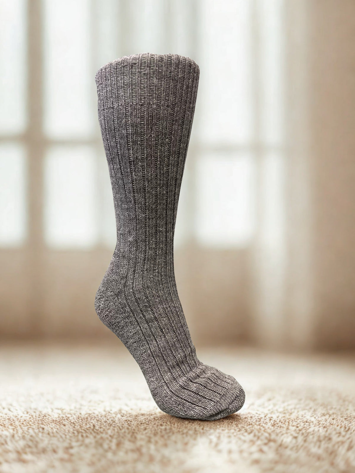 grey non-elasticated activity alpaca sock on a neutral background